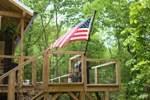 Treehouse deck showing grille and American Flag